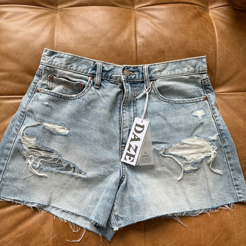 Women’s distressed faded blue jean shorts. NEW with tags. NEVER been worn.